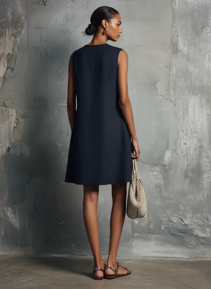 Mini Vestido Azul Oscuro con Escote Redondo, Botonadura Asimétrica y Bolsillo Lateral